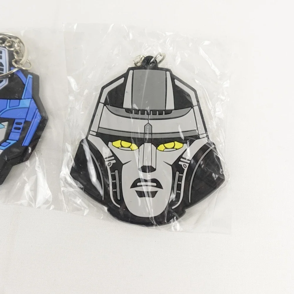 Transformers One (2024) Optimus Prime Megatron Keychain AMC Fan Event Exclusive